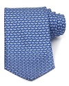 A pack of jaunty schnauzers patterns this luxurious silk tie, rendered in a classic silhouette for traditional appeal.