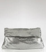 Rock a heavy metal with this sequin clutch from BCBGMAXAZRIA. Boasting an easy-to-wear fold over shape, this bag shines with every evening look.