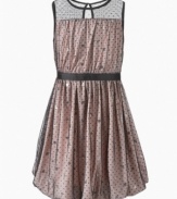 Darling sleeveless dress draped with a mesh of sequin accents is this sweet sophisticated dress by DKNY.