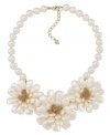 Beautiful blooms. Three large flowers made of shimmery glass stones adorn this stunning statement necklace from Carolee. Crafted in gold tone mixed metal. Approximate length: 16 inches + 2-inch extender.