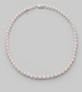 From the Akoya collection. A classic strand of white Akoya pearls with a pretty filigree clasp. 6.5mm white round cultured pearls Quality: A1 18k white gold Length, about 18 Mikimoto signature clasp Imported