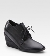 Traditional leather silhouette enhanced by an on-trend wedge and convenient lace-up front. Stacked wedge, 3 (75mm) Leather upper Leather lining and sole Made in ItalyOUR FIT MODEL RECOMMENDS ordering true size. 