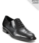 Classic cap toe oxfords, crafted from fine leather. Lace-up leather upper. Leather lined and sole. Slight stacked heel. Signature gancini embossed on heel.