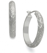 A dazzling display. Giani Bernini's hoop earrings, set in sterling silver, sparkle with a stylish pattern along the outside that only enhances the appeal. Approximate diameter: 7/8 inch.