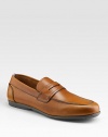 Smooth leather style crafted in Italy with penny loafer detail. Leather lining Padded insole Rubber sole Made in Italy 