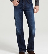 Low-waist, five-pocket bootcut jeans with zip fly. Deep blue wash with no fading, no distress. Features whiskering at the crotch and back of knee.