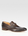 Burnished leather with silver horsebit detail. Leather sole Made in Italy 