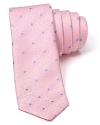 The slim, modern silhouette of this alluring polka dot tie separates it from the old guard. Wrought in exceptional silk for a luxurious addition to your wardrobe, it pairs well with fine dress shirting and more casual looks alike.