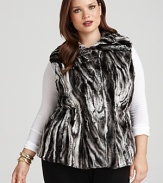 Embrace the season's fur and faux fur trend with this plush two-tone vest--a must-have for your quick glamour fix.