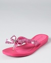 Go off-duty with GUESS--the Tutu bow flip flops offer playful, casual style.