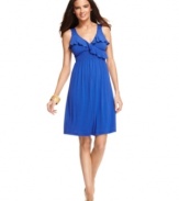 Cover up with flirty ruffles! Kenneth Cole Reaction's empire-waist dress looks cute on or off the beach and is offered in this season's hottest colors!