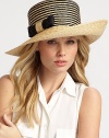 A jaunty, asymmetrical brim is offset by a graphic striped crown and attached bow detail.StrawBrim, about 5 wideMade in Italy of imported fabric