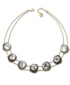 A natural inspiration. Swarovski's innovative gold tone mixed metal statement necklace features seven clear crystals in an exclusive cut. Each one is embellished with small crystals, creating breathtaking light reflections. Approximate length: 16-1/2 inches.