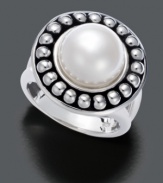 Flawless contemporary design. One lustrous cultured freshwater pearl (10.5-11 mm) rests among a circle of gleaming spheres in this sterling silver ring by Fresh by Honora.