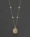 Intricately textured sterling silver and 18 K gold frame faceted canary crystal and white sapphires.. By Judith Ripka.