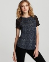 Elevate your t-shirt collection with this Rebecca Minkoff burnout tee patterned in python.