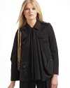 An avante-garde silhouette impeccably tailored in fine Italian wool, fuses the drama of a cape and the warmth of a jacket.Asymmetrical point collar Epaulettes with dangling goldtone chains Left cape sleeve Right long sleeve Sleeves have four button cuffs Front button closure Center front drape Front button flap pockets Back flap shoulder yoke Back vented hemAbout 24 from shoulder to hem Fully lined Wool; dry clean Made in Italy