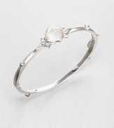 From the Superstud Collection. A graceful bangle of bright sterling silver is dotted with pointy studs and highlighted by a faceted cushion of mother-of-pearl layered with clear quartz for a luminous effect.Mother-of-pearl and clear quartzRhodium-plated sterling silverDiameter, about 2.25Box-and-tongue claspImported