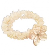 Prim petals. This pretty stretch bracelet combines three strands of pink cultured freshwater pearls (6-7 mm), pink shells and rose quartz (97-3/4 ct. t.w.) with a sweet flower accent. Set in sterling silver. Approximate length: 7-1/2 inches. Approximate diameter: 2 inches.