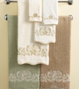 Soft and feminine, the Venetian Scroll wash towel marries a delicate look with durable Egyptian cotton. Swirling blossoms embroidered in creamy shades bloom on muted sage, ivory and linen for serene elegance.