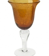 The eye-catching Iris goblet makes a big impact in any setting with a rich amber hue and tiny bubbles trapped in dishwasher-safe glass. From Artland.