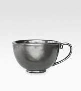 A unique mottling technique lends a hand-thumbed, hammered design to a beautiful metallic stoneware coffee cup with the look of an old-world favorite. From the Pewter Collection10-oz. capacity3H X 4½ diam.Ceramic stonewareDishwasher safeImported