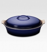 Crafted from heavy stoneware, Le Creuset cookware is the ultimate ingredient for chefs and home cooks worldwide. With its secure lid, this covered casserole is a convenient choice for transporting dishes to parties and picnics. Not only does the lid provide an effective moisture and heat lock for the dish, but it prevents spills and protects its contents.