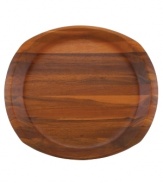 Less is more with Dansk wood serveware. A round surface takes shape in a subtly squared tray for carrying any number of foods. The contemporary look and rich wood grain combine for endless casual appeal.