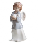 Utterly irresistible, the Heavenly Love figurine combines a sweet cherub and baby bunny in delicately glazed Lladro porcelain.