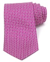 Repeating Gancini logos are rendered in two complementary colors and patterned with a whimsical design on this superior silk tie, offering a bit of refined luxury for the modern man.