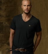 The embodiment of effortless style, this relaxed V-neck tee in soft cotton jersey looks great layered or all on its own.