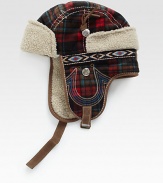 A winter essential, this trapper hat is crafted in a bold check pattern with signature horseshoe detail and trimmed with plush faux fur for long-lasting warmth.50% wool/50% polyesterDry cleanImported