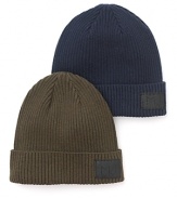 Solid ribbed beanie crafted in a cozy cotton/wool blend, with leather logo patch.