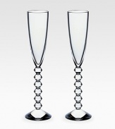 A Deco-inspired design mouthblown in France from clear crystal with a wide bowl and angular stem. From the Vega Collection Set of 2 Each, 11½ high Hand wash Handmade in France 