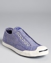 In chic chambray, these slip-on sneakers from Converse Jack Purcell offer laid-back style with a classic twist.