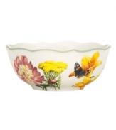 Garden party. The Floral Meadow all-purpose bowl brings eternal spring with a mixed bouquet rooted in resilient everyday porcelain. A scalloped edge and green banding add to the charm of the graceful mix-and-match Lenox dinnerware collection. Qualifies for Rebate