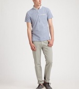 Cotton pique polo gets a modern update with contrasting buttons and buttoned-down collar, in a lightweight, slubbed finish.Four-button placketChest welt pocketCottonMachine washImported