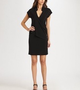 The LBD re-imagined, this jersey design features a classic mandarin collar leading to a seductive v-neckline and a fashion-forward draped, asymmetrical front. V-necklineShort sleevesDraped, asymmetrical bodice detailAbout 39 from shoulder to hem70% rayon/24% polyester/6% spandexDry cleanImported Model shown is 5'11½ (181cm) wearing US size Small. 