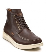 A handsomely rugged boot from Paul Smith rendered with a moc toe, contrast stitching and chunky contrast rubber sole.