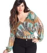 Leave them wanting more with Baby Phat's printed plus size top, featuring an open back.