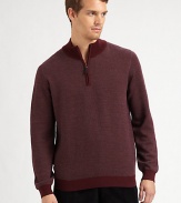 A sporty pullover with a sophisticated mockneck collar in a fine, textured diagonal knit.Ribbed mockneck collarHalf-zip frontLong sleeves with ribbed cuffsRibbed hemMerino woolDry cleanImported