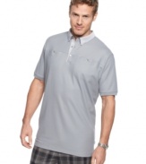 Beyond the basic. Add a touch of detail to your classic style with this pocketed polo shirt from Calvin Klein.