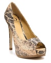 Slither and slide in the Lainey snake print pumps from Kelsi Dagger, finished with a peep toe and towering heel.