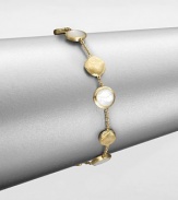 From the Jaipur Resort Collection. Discs of hand-engraved, brushstroke-textured 18k gold alternate with buttons of lustrous mother-of-pearl along a delicate gold chain.Mother-of-pearl18k yellow goldLength, about 7Lobster claspMade in Italy