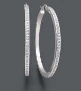 A sweet combination of traditional style and added glamour. These classic hoop earrings shine with the addition of sparkling diamond accents. Set in sterling silver. Approximate diameter: 2 inches.