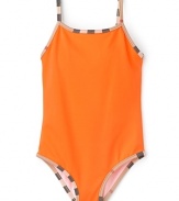 In bright cadmium orange, this one-piece Burberry swimsuit adds vibrant poolside style to adventurous afternoons.