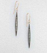 Aptly named, these elongated pod-like strands of oxidized silver are set with graduated rows of dazzling diamonds, tapering as they drop.Diamonds, .14 tcwSterling silver and 14k yellow goldDrop, about 1½Ear wireMade in USA