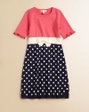 Polka dots and a charming bow breathe new life into this charming knit frock.ScoopneckShort sleeves with ruffled cuffsPullover styleWaistband with bow detailCottonMachine washImported