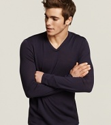 Slim fit v-neck sweater with unfinished seams for subtly rag-tag look.