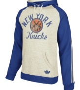 Keep warm as you cheer and rant for the NY Knicks in this pullover hoodie by adidas.